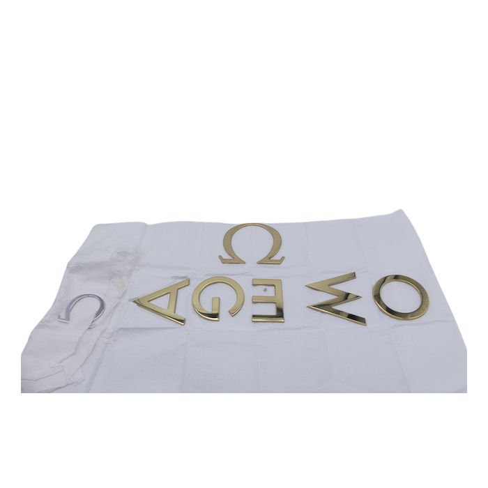 Omega lettres Logo - golden letters