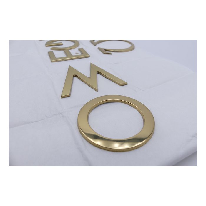 Omega lettres Logo - golden letters