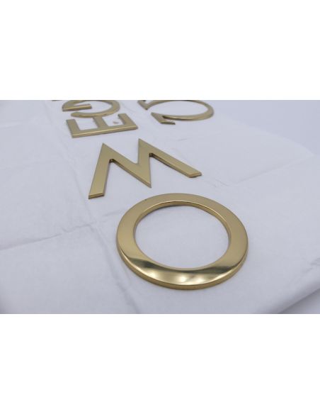 Omega lettres Logo - golden letters